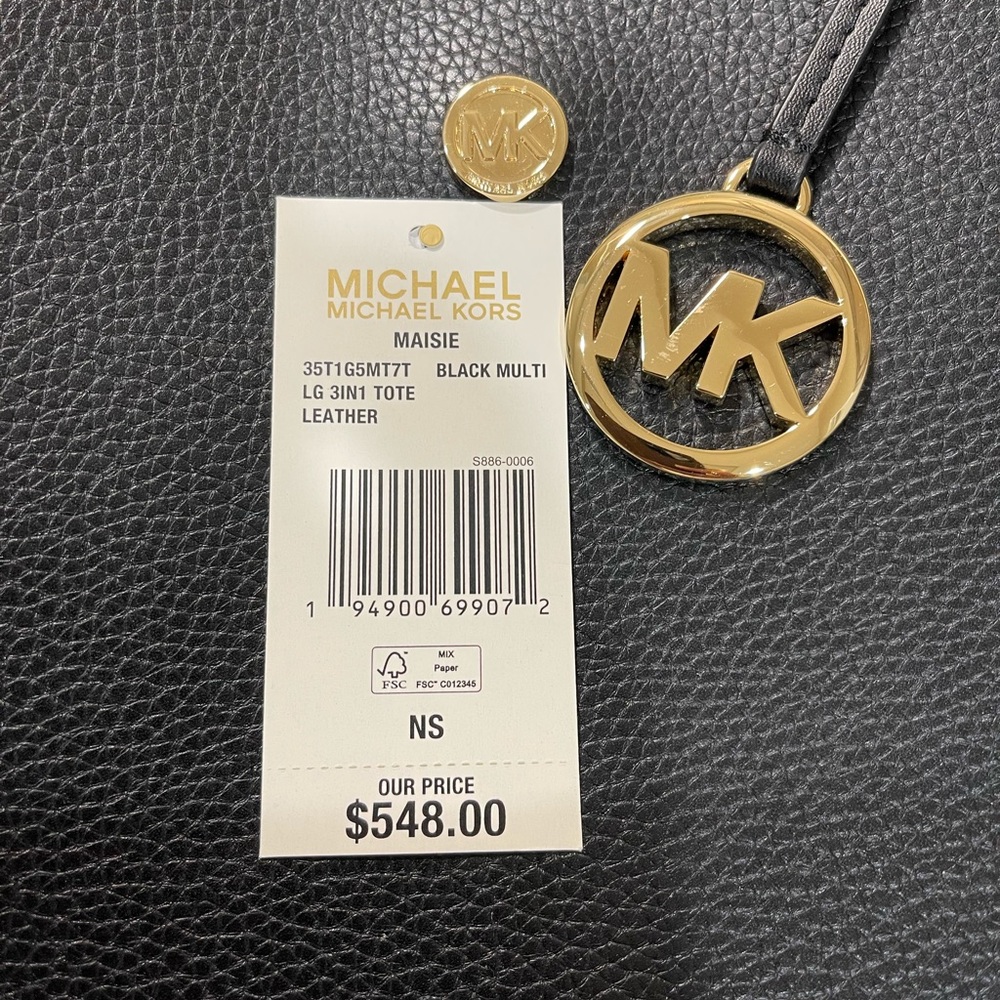 Authentic Michael Kors black leather handbag.